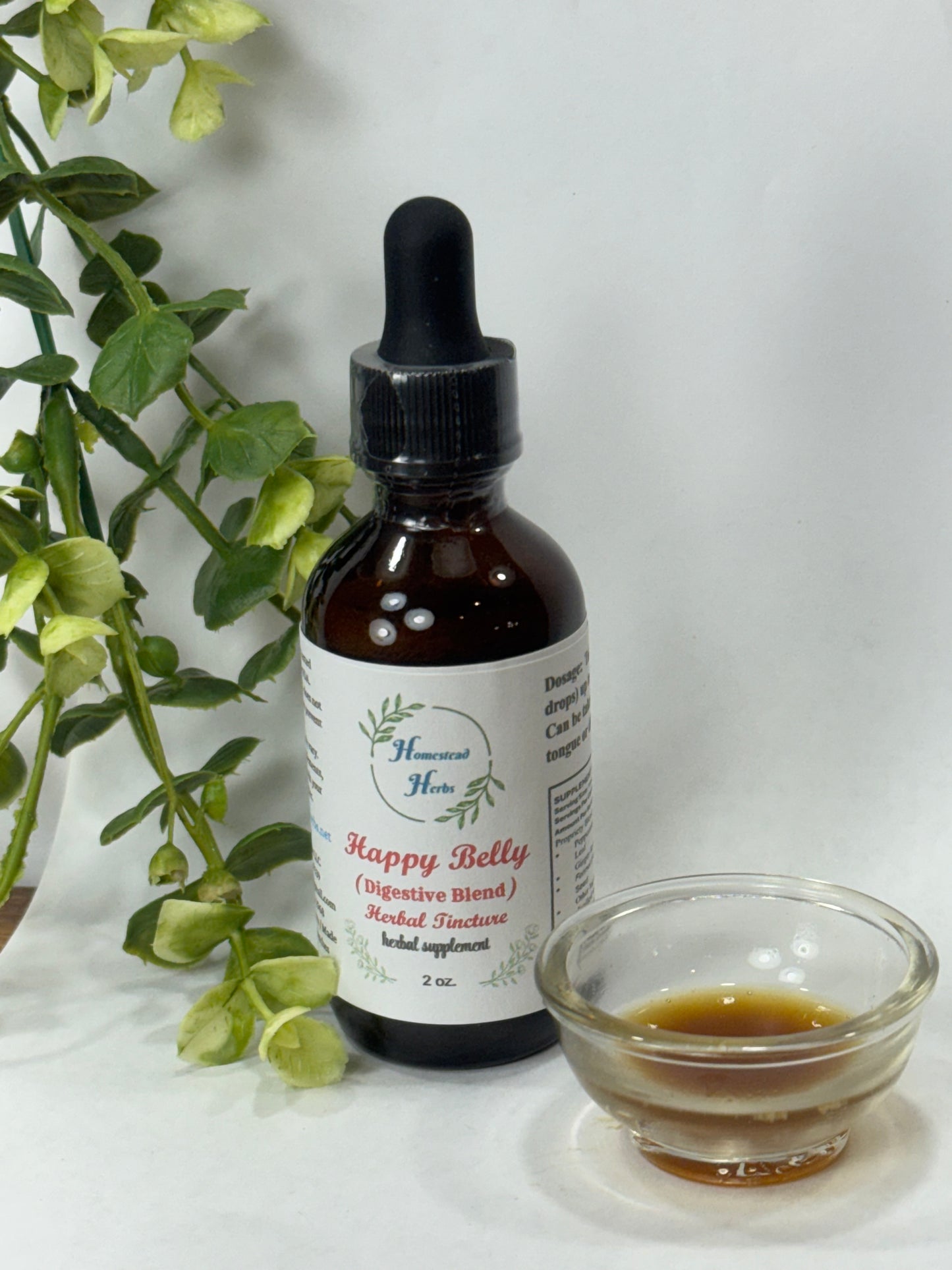 Happy Belly tincture with dropper, featuring digestive herbs like peppermint, ginger, and fennel