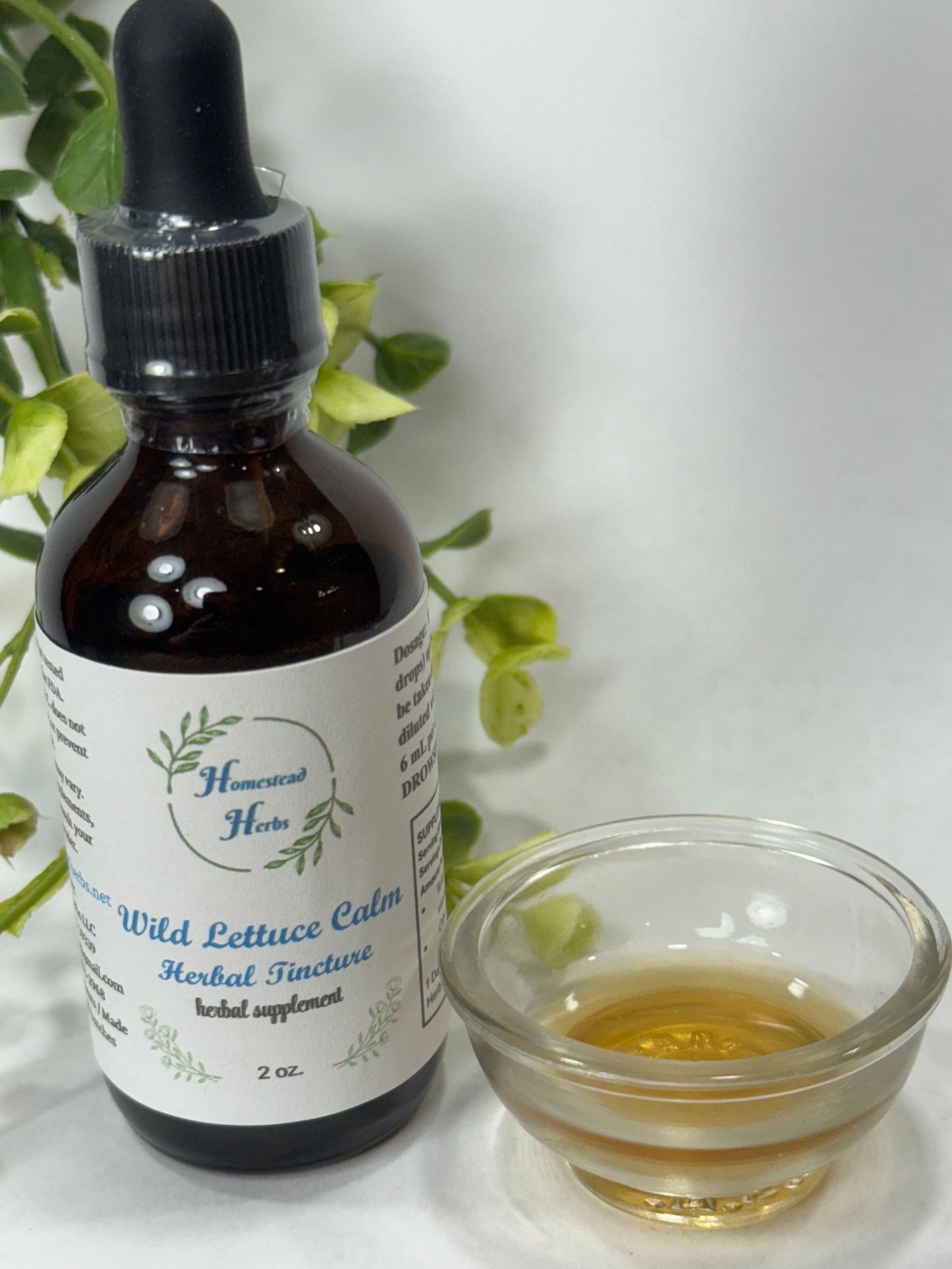 Wild Lettuce Herbal Tincture being dispensed from a glass dropper, a natural calming remedy for anxiety and sleep support