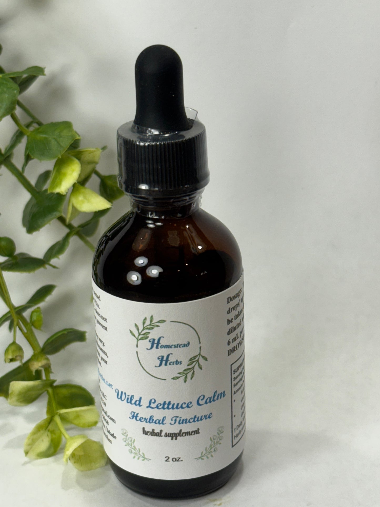 Wild Lettuce Herbal Tincture alongside dried wild lettuce leaves, an herbal remedy traditionally used for calming and relaxation