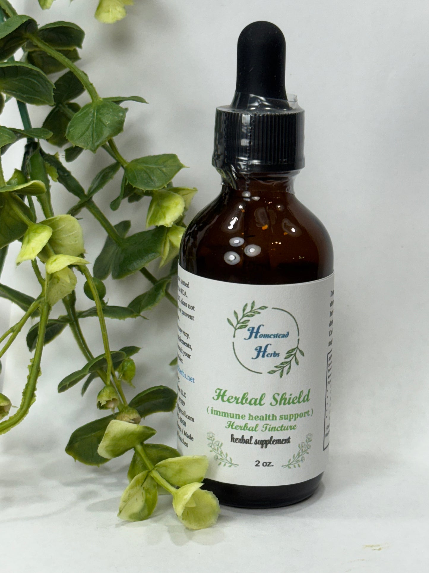 Herbal Shield tincture bottle – liquid herbal extract with oregano, thyme, rosemary, and ginger